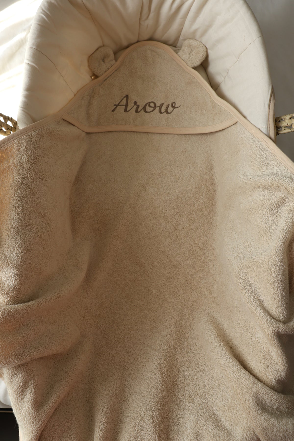 Personalised beige baby hooded towel with embroidered name Arow