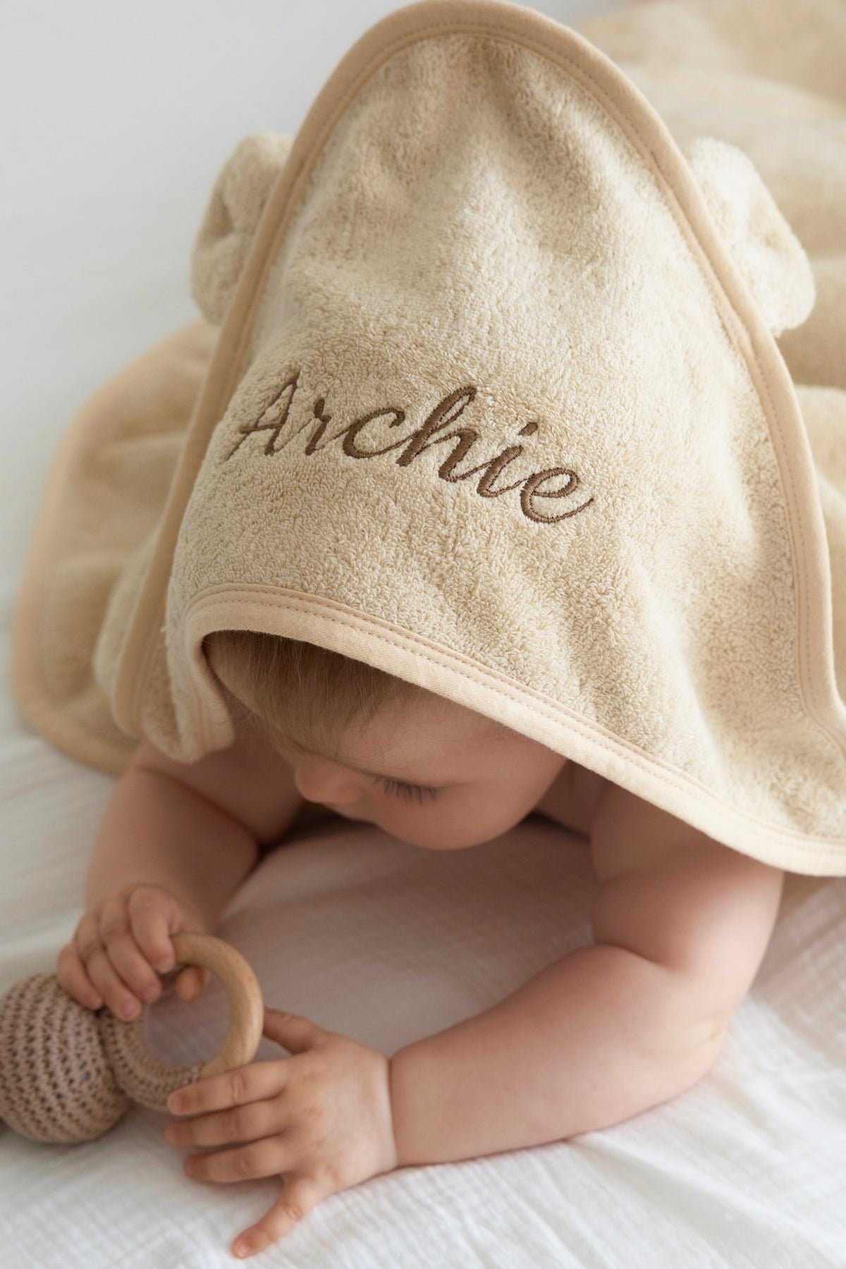 Personalised beige baby hooded towel with embroidered name