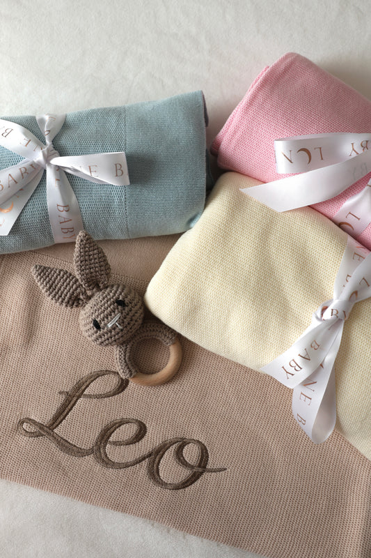 Personalised knitted cotton baby blanket with embroidered name and bunny comforter in pastel colours