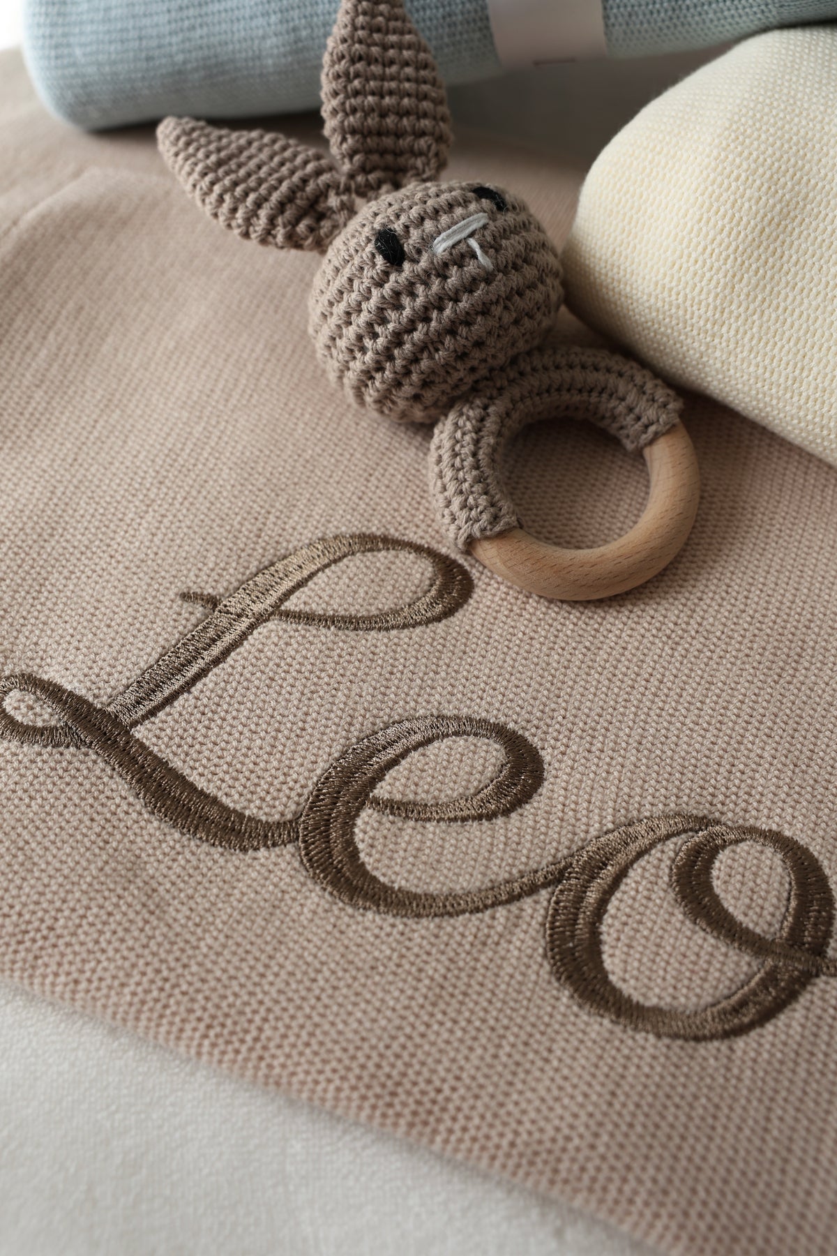 Personalised knitted baby blanket with embroidered name and bunny comforter
