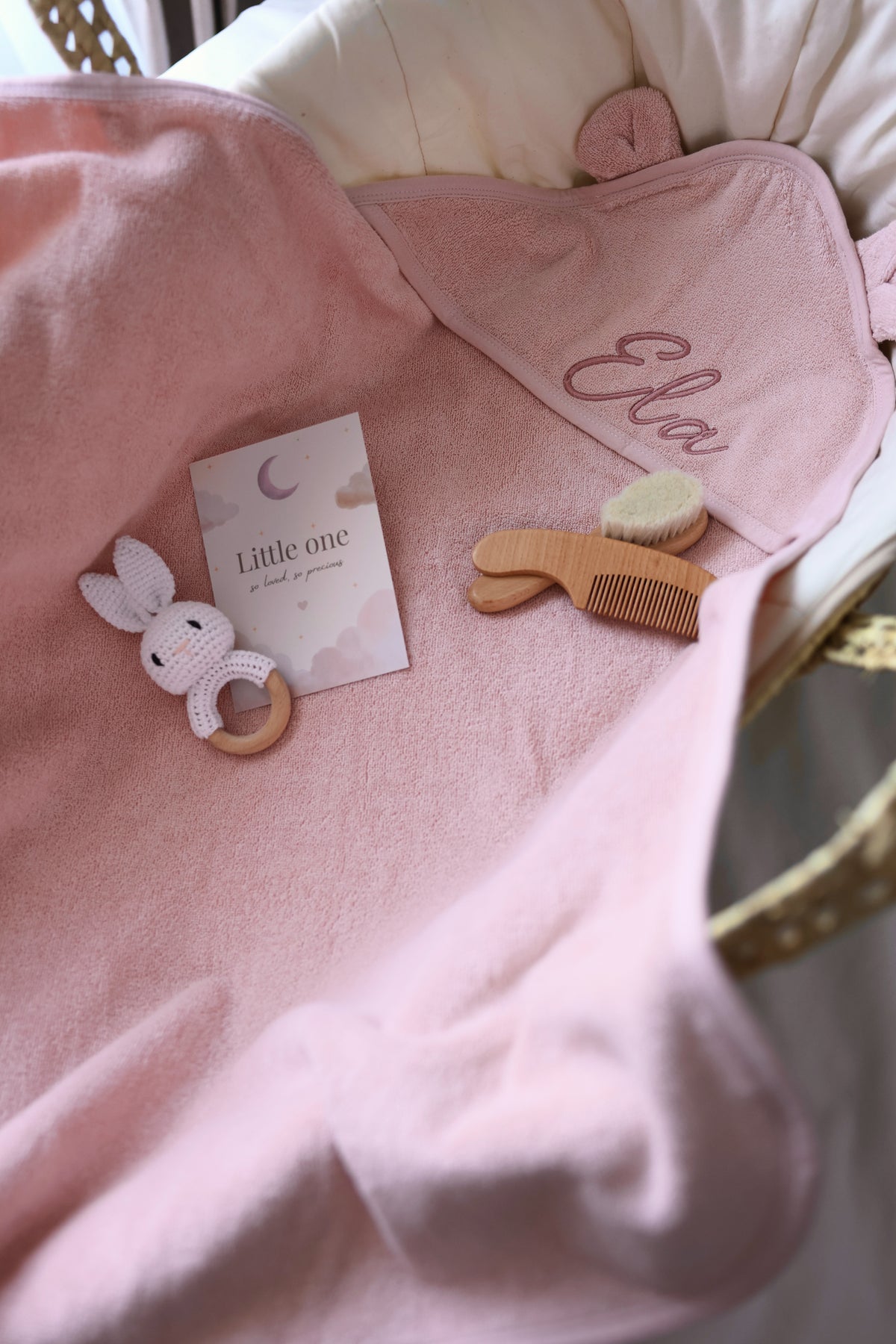 Personalised pink baby hooded towel with embroidered name and baby accessories